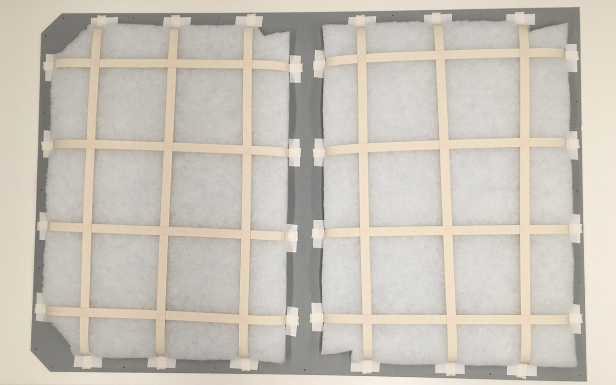 Grid structure keeping white batting in place