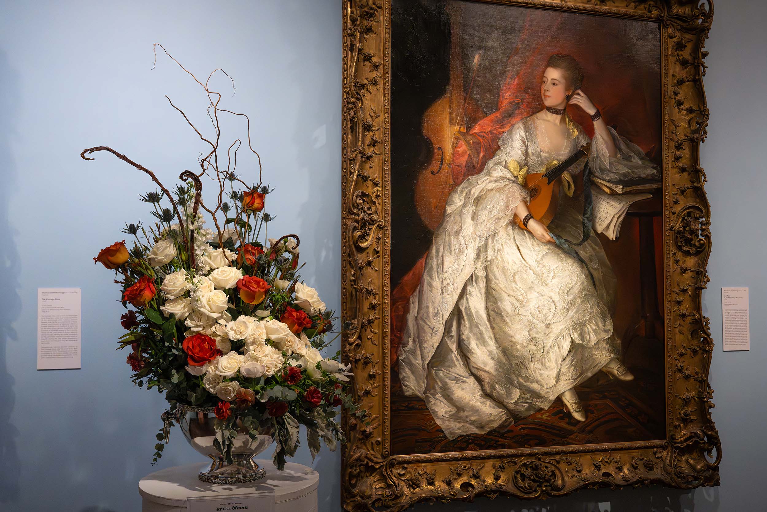 An asymmetric floral arrangement with white and red flowers