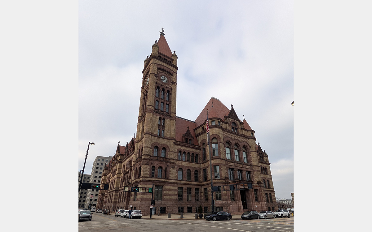 Large stone building with red roof