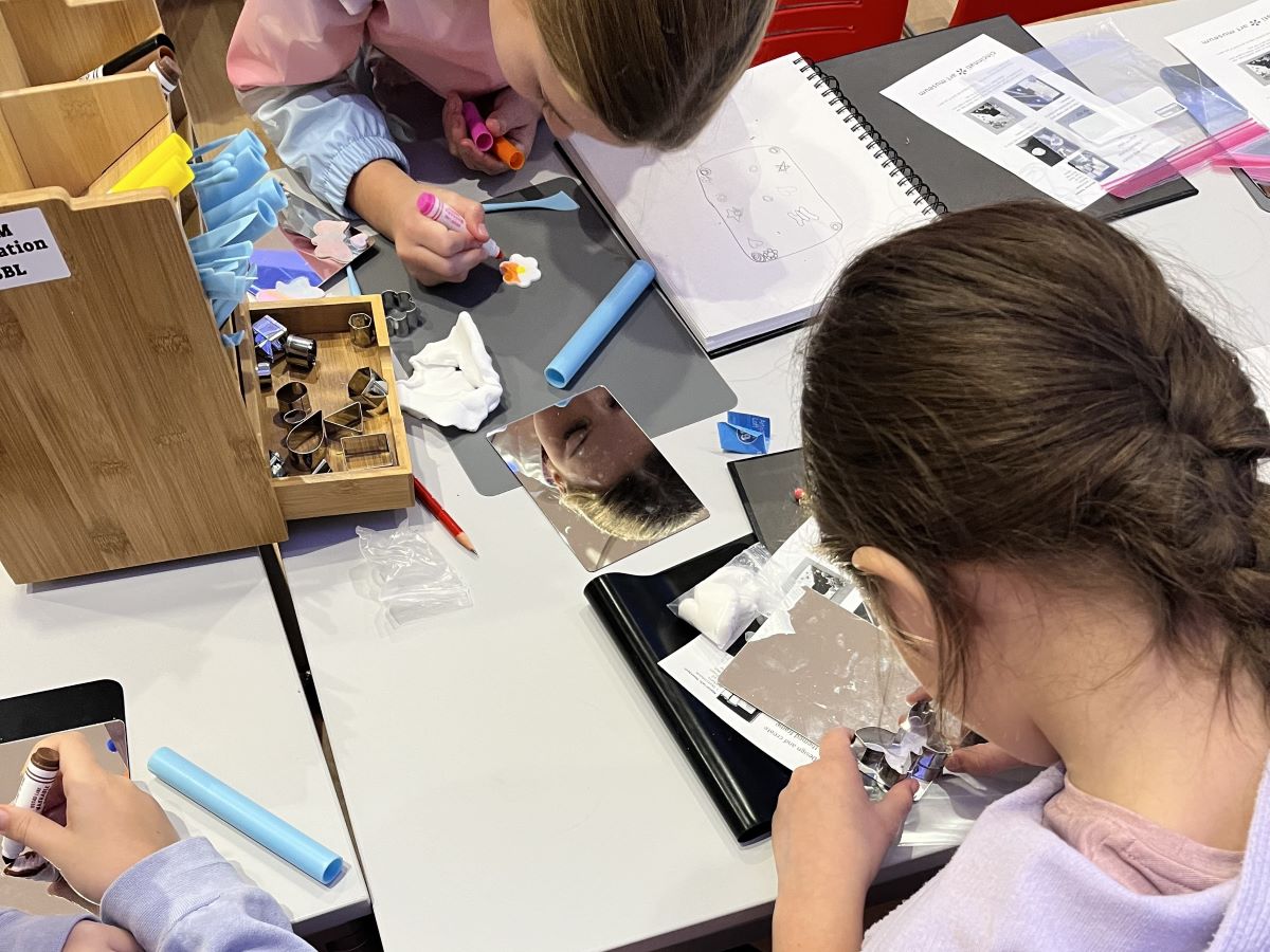 Kids making art in the REC. Photo taken from above.