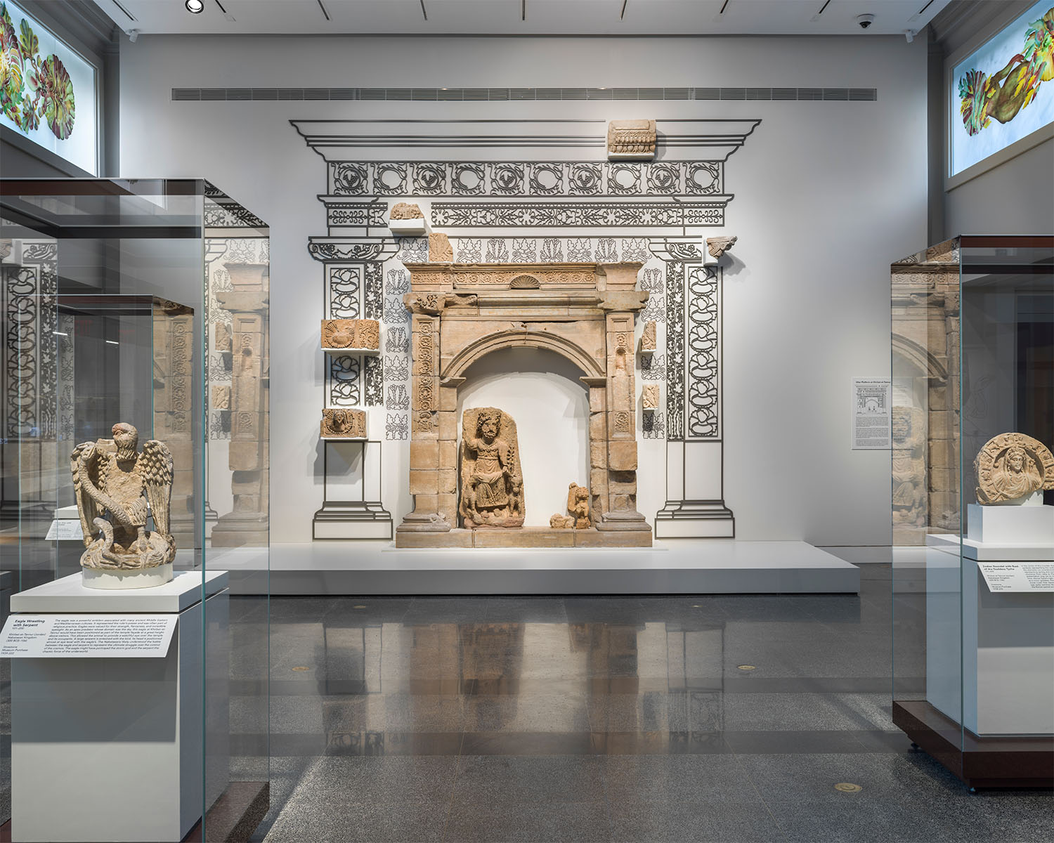 A large stone shrine in an open, white gallery