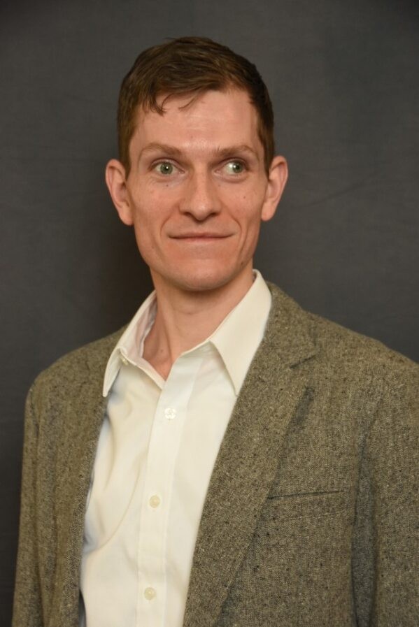 A white person in a blazer