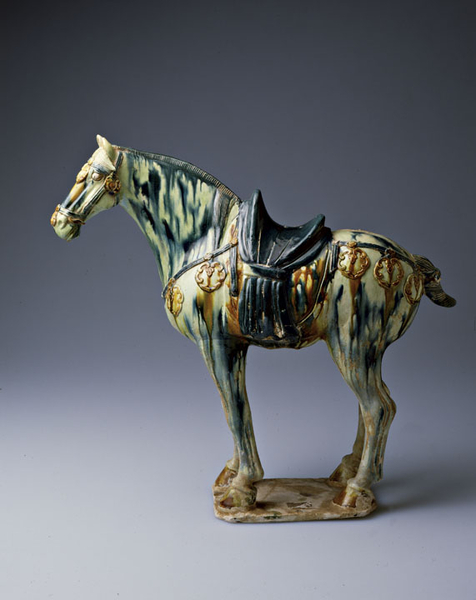 Ceramic horse streaked with blue, green, and gold glazes