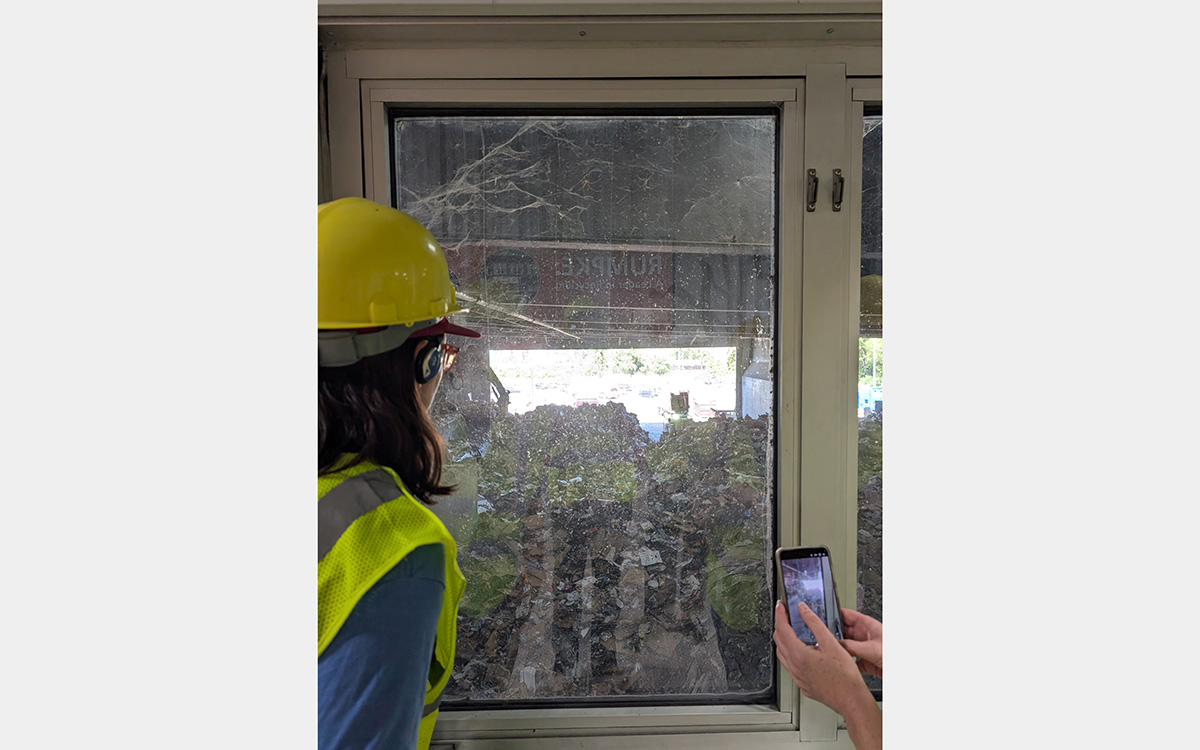 Looking out a window at trash piles