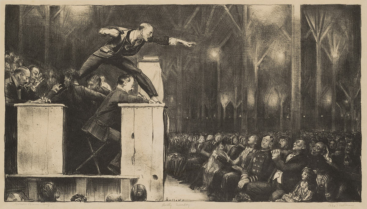 Here, the preacher, Billy Sunday, is captured from the side as he stands atop two raised parallel pulpit-like tables in a wide stance; his left leg is on the front table his right on the table behind.