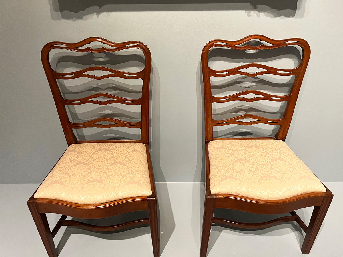 Two chairs with their newly-reupholstered seats