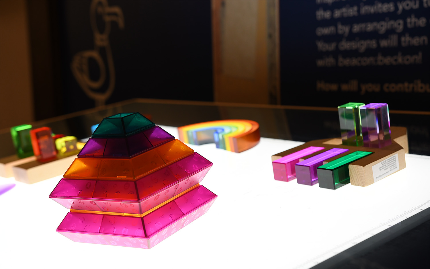 Translucent, colorful shapes on a lit table