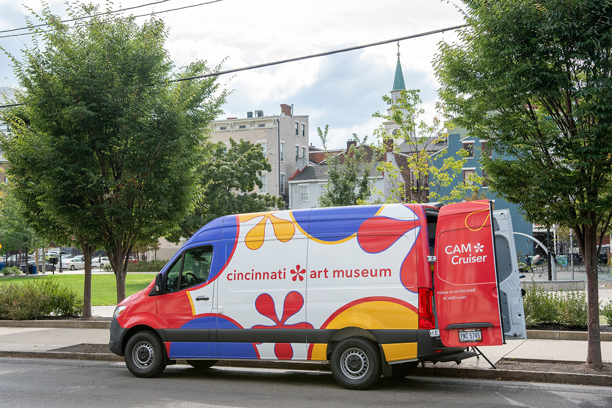 The CAM Cruiser sits by a park