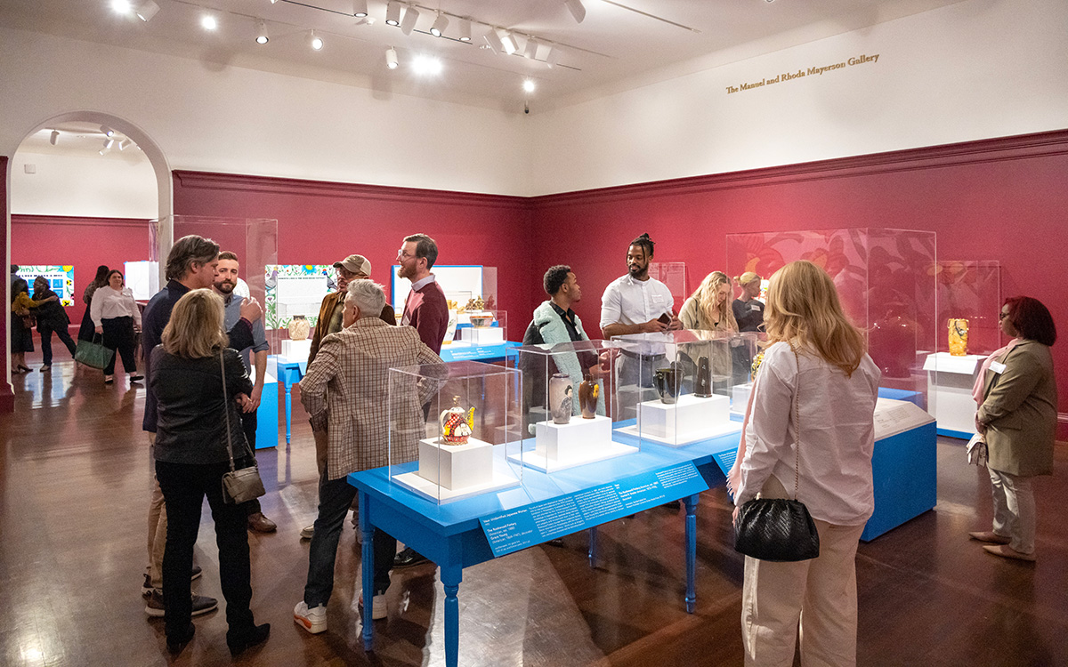 Many members explore a ceramics exhibition